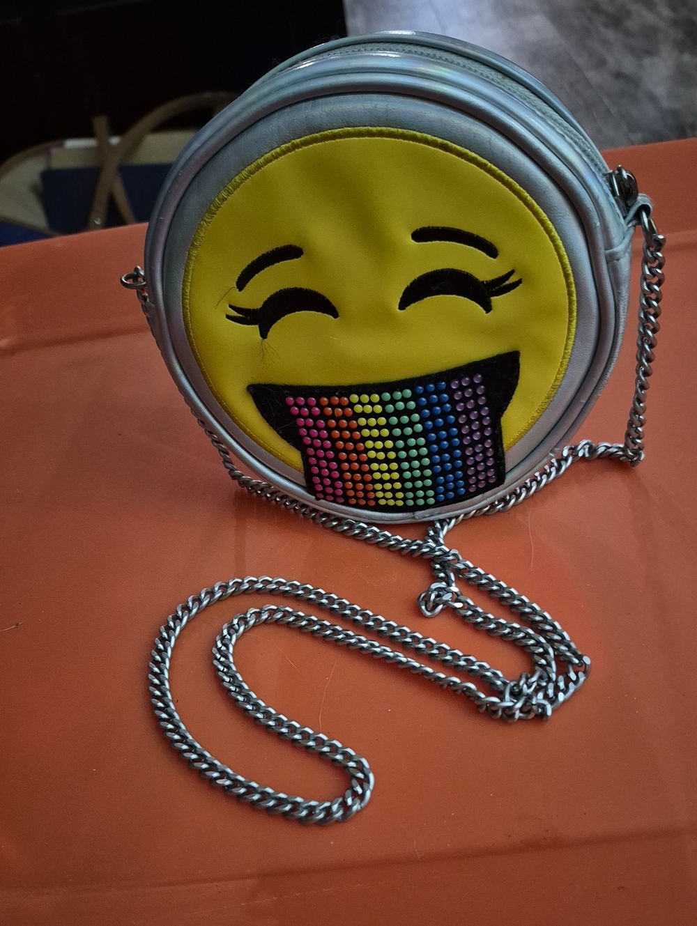 Place Silver Crossbody Bag with Yellow Emoji and Rainbow Tongue